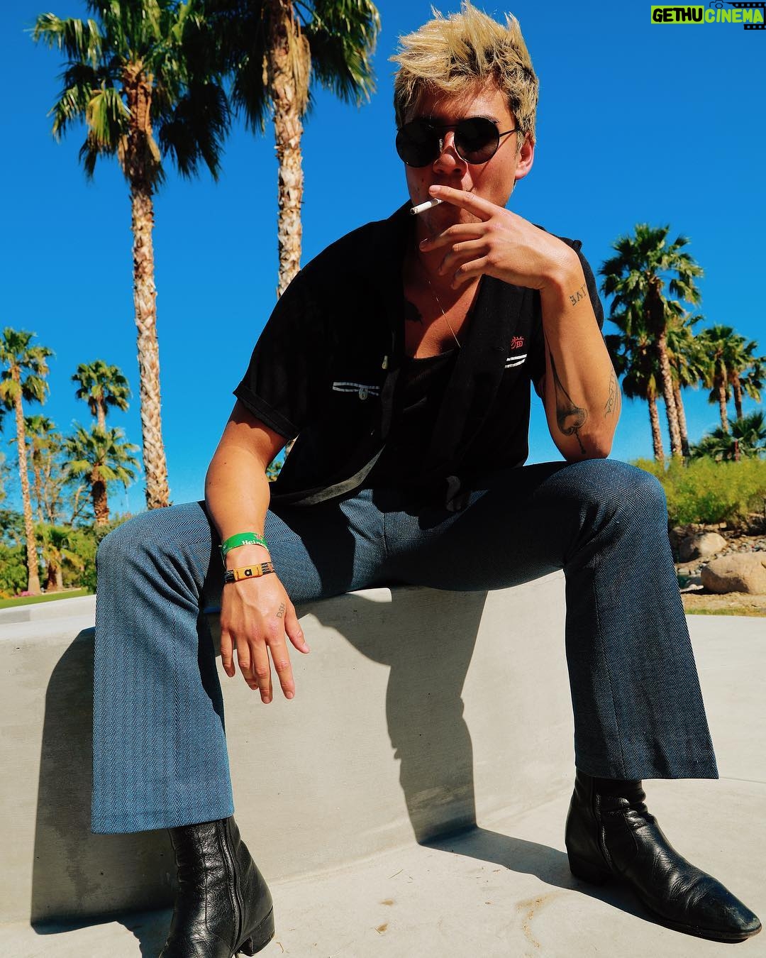Calum Hood - 616.1K Likes - Yeah, your boy caved and went to Coachella this weekend. Photos by @tornblackjeans.