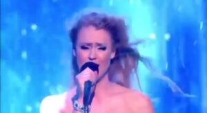 Camilla Kerslake Instagram - When you're caught in the storm just keep singing through! How is everyone feeling this week? #TB to singing #Stay by @adamhurts & @theohurts for @teenage_cancer on @itv. This is such a tough time for absolutely everybody. I was a little hopeful that some opera projects I was involved in would go ahead in September but with the new government advice its unlikely I'll work again until Spring 2021. I feel so deeply for everyone who's been effected by the brutal virus. Know that I'm thinking of you all #SaveTheArts #StaySafe #covid19 #InstaFunny #Funny #Storm #Wet #LetTheMusicPlay