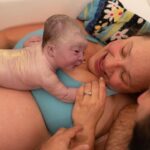 Carson Meyer Instagram - Homebirth VBAC Story ✨Three years ago @anasiya7 reached out to me about being her doula. She was birthing in a hospital and felt passionately about having an unmedicated birth. When her labor began she rode every surge with strength and determination. At 9cm after laboring unmedicated for 24 hours her son had his own plans on his entrance into the world. With fetal heart rate concerns and a swollen cervix a cesarian birth became the best option for him but not an easy one for her. Years later when @anasiya7 called me to tell me she was having another baby she knew that this time she wanted to birth at home with the care of a midwife. When her due date rolled around, labor began that evening. She rushed home from the movie theater and called me and @lamidwifeabby. Things were moving fast, she was already pushing. While we raced over to her, her midwife Abby was on FaceTime coaching her husband on how to catch the baby if we weren’t able to make it in time. Fortunately we did! We asked her if she wanted to get into the tub as she had once envisioned. Shortly after she got into the warm bath water her beautiful Elinor was born (on the birthday of her grandmother). What an honor to get to document and hold the hand of such a strong women through her births both in the OR and the bathtub! Both wildly beautiful and rich with courage. This year has been so special for me as a doula getting to work with the same mamas a second time. Such a powerful reminder that no two births are ever the same (even with the same person). No two babies are ever the same which is why birth dances to the beat of its own drum. Like life itself, birth is mysterious and without a formula. It is wild.
