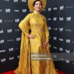 Chantal Thuy Instagram – This week at #TIFF was a dream come true. It’s always been on my bucket list to tell a Vietnamese Québécois story on the big screen and to be part of a film based on such a celebrated novel by @kimthuylythanh fulfilled a deep need as a storyteller. Not only is it the first of its kind for this community, but walking in her mother’s shoes helped me understand my own mom’s journey more deeply. In the process of shooting this film last year, I too became a first time mom.
To add to this, the most magical part of the night besides watching the film with my RU family and best friends, was being dressed in a custom traditional Vietnamese Áo Dài khăn đóng created by @thainguyenatelier. Thai not only made me feel beautiful in this dress (as a 8month postpartum mama, I was nervous about getting back on a red carpet 🤷🏻♀️), but he made me feel pride in representing and celebrating my culture. I’m holding onto everything I can that is a part of my Vietnamese heritage (language, food, customs) and wearing this beautiful Áo Dài khăn đóng certainly is an important part of it.
I’m writing this as my sister union in the US is on strike, and acknowledge that we’re going through an extremely difficult time right now. I’m thankful that SAG-AFTRA allowed me to promote this film (under a UDA contract). I’m proud to have worked on my first Canadian film, which was entirely funded by the Canadian & Quebec government agencies @la.sodec @telefilm_canada @amalga.prod @imminafilms @tiff_net
❤️ Gorgeous hair & makeup by @ivylammakeup Toronto International Film Festival (Tiff)