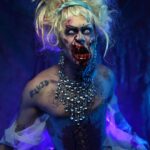 Charity Kase Instagram - Prince Harming 👑 🪓 Photo by the amazing @horrifymeuk Used: @mehronmakeup @mehronuk liquid latex, fake blood, scar blood @bennyemakeup setting spray, liquid liner @hudabeauty setting spray, primer, flawless powder, concealer @beautybaycom brushes and eyeshadow pallet #cinderella #zombie #horrifyme #dragmonster London, United Kingdom