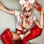 Charity Kase Instagram - Dr Kase will see you now 💉 🩸 Wearing full Halloween look by the gorgeous devils over at @lovehoneyofficial 👹 Discount Code: CHARITYKASE20 #Lovehoney #HalloweenCostume #DragMonster #AD #SilentHill London, United Kingdom
