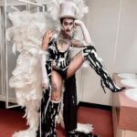 Charity Kase Instagram - Fallen angel showgirl in hell vibes for the season 3 tour 💀🖤 Corset by @briandecarvalho Wings by @tigerlilythemewear Gown embellished, hand painted and accessories made by @bycharitykase #dragraceuk #dragmonster London, United Kingdom