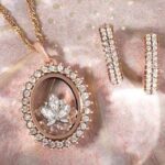 Cherie Jimenez Instagram - So sweet of @origamiowl Think Goodness to feature my beautiful family & honor my Mom @sandydaly68 as a Gigi in the Annual Catalog ✨ Dedicating the Phoenix Charm to the birth of my sweet baby boy Phoenix ❤️‍🔥 My mom has worked for this wonderful company for over 9 years. I have watched her blossom & grow into a force for good. She has touched so many lives & loves what she does. Thank you @chrissyweems & @bellagraceweems for everything that you do for her, for our family ✨ The only Mascara I wear & Most of the jewelry I wear is from her site 🦋🪄Campsite.bio/sandydaly or go to her Instagram & click the link in her Bio • @sandydaly68 ✨