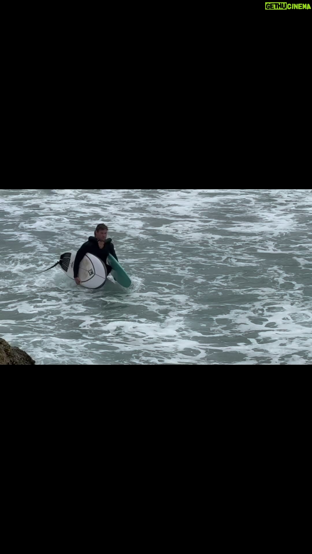 Chris Hemsworth Instagram - Welcome to @centrfit latest workout. Just throw a grommet on ya back and plow your way through a strong incoming tide. Make sure the kids really got his claws into your jugular to restrict blood flow and oxygen levels to truly challenge the body and mind #sportssceince 🎥@juzmac