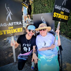 Chris Lamica Instagram - I am honored to have spent so many days walking the line and standing arm by arm with my brethren... fighting not only for the future of our profession, but of the industry as a whole. 

It's amazing what can be accomplished when workers and people from all walks of life come together, in unity, and with a vision for a better, and more just, future. And DON'T BACK DOWN.

We are at a pivotal time in history, with the greed of industries across the country are decimating the working class. Often seeming like a David vs Goliath battle that never can be won by David. But remember... you are worthy of getting what you rightfully deserve. And in this time of unprecedented corporate greed, we met it, head on, with an unprecedented show of worker response and force.

Together, people and unions across the country, from all professions and backgrounds, can help fight for a change that can create a fairer and more democratic world. One based on the principles of love, solidarity, empathy, respect, equality, and compassion. 

I am grateful of my union, @sagaftra -- and with immense amount of pride, and humility, I say.... I am an actor!

---------------

In slide two -  one of the most memorable experiences... I met the Screen Actor Guild's FIRST female President, Kathleen Nolan, and got to talk at length to her and her son @spencergarrett1 - she was and is such an inspiring human, whose lifelong commitment to the profession and Union cannot be overstated. Oh, and she gives the sweetest hugs!

---------------

And the most meaningful experience.... my mom and dad, who are not attached to the union or profession in any way, drove across many state lines to be protest with me, and for me. It brings tears to my eyes writing this, as it is a moment of love and support that goes beyond words, and into action. Their unconditional love throughout means the world 🌎 ❤️ 

---------------

And to the hundreds (honestly, maybe thousands) of others I had the pleasure to meet and get to know on the line and along the way... our hard work paid off! And I hope "when you wish upon a star" that all your wishes and dreams come true ❤️