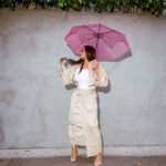 Claire Sulmers Instagram - Had fun trying on @karenbritchick ‘s @amazonfashion drop! I love this skirt, you can stash everything you need in the pockets and be on your way! Hot! Or Hmm..? #karenbritchickxthedrop drops tomorrow, get your pieces at the link in my Instastory. What say you? Shoes: @femme_la 📸 #shotwithmyiphone / @directdevin #thebomblife #amazon #amazonfinds #amazonfashion #khaki *I thought they said it never rains in Southern California😤