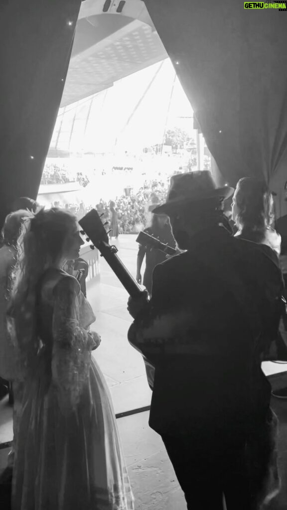 Clare Bowen Instagram - Hit the YouTube link in our bio to catch a new video premiering right now! 🎥 ✨ It was one of our favourite performances in Australia, and we’re so happy we got to experience it with @timothyjamesbowen! 🖤✨ #youtube #newvideo #livemusic #bts #behindthescenes #bowenyoung #christmas #summer #australia #nashville #americana #johnlennon #timothyjamesbowen #brandonrobertyoung #clarebowen #carolsbycandlelight #visionaustralia Sidney Myer Music Bowl