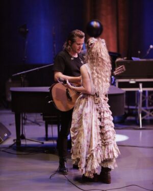 Clare Bowen Instagram - ❤️NASHVILLE❤️ See you TONIGHT at @anzieblue! 🥰 We’re so honoured to get to be a part of @americanafest, and play a showcase before we head out with the #NashvilleReunionTour! (Here we are being gross behind the scenes in rehearsal.. 🫠💕✨) See you tonight! Ticket link in bio. ♥️

📷 @timothyjamesbowen 
👗 @magnoliapearlclothing

#nashville #anzieblue #opry #rehearsal #americana #americanafest #duo #love #kiss #magnoliapearl #lovers #nashvillecmt #nashvilleabc #bowenyoung #clarebowen #brandonrobertyoung #reunion #livemusic #showcase