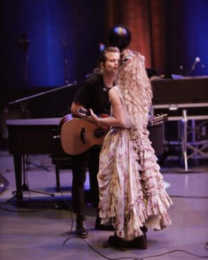 Clare Bowen Instagram - ❤️NASHVILLE❤️ See you TONIGHT at @anzieblue! 🥰 We’re so honoured to get to be a part of @americanafest, and play a showcase before we head out with the #NashvilleReunionTour! (Here we are being gross behind the scenes in rehearsal.. 🫠💕✨) See you tonight! Ticket link in bio. ♥️

📷 @timothyjamesbowen 
👗 @magnoliapearlclothing

#nashville #anzieblue #opry #rehearsal #americana #americanafest #duo #love #kiss #magnoliapearl #lovers #nashvillecmt #nashvilleabc #bowenyoung #clarebowen #brandonrobertyoung #reunion #livemusic #showcase