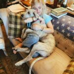 Clare Bowen Instagram - Holding baby sis as much as possible before this activity starts resulting in crushing injuries. 🐺🎀🫧 #irishwolfhound #owmyfemur Minnamurra River