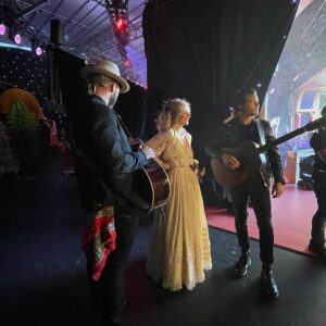 Clare Bowen Instagram - @carolsbycandlelight_aus rehearsal day behind the scenes chaos series. Also the day @brandonrobertyoung became best friends with the illustrious @themarciahines, and we deduced that @pattinewtonofficial came off the same (very limited edition) height production line as @dollyparton. 👯‍♀️✨ Thank you @harlowlovesdaisyofficial for Clare’s gorgeous rehearsal day ballgown! Nothing like a hand restored century old silk skirt to make a three hundred year old faerie feel extra everything.. ♥️🕯️✨

#carolsbycandlelight #visionaustralia #rehearsal #bts #harlowlovesdaisy #magnoliapearl #timothyjamesbowen #pattinewton #marciahines #clarebowen #brandonrobertyoung #bowenyoung #melbourne #nashville #chaos #allsaints #americana #countrymusic #christmas