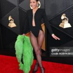 Coi Leray Instagram – 2X GRAMMY NOMINEE 💋🎏
📸 @princeofthegram 👑 

 Special Thank You to @anthonyvaccarello and the entire team at @ysl for allowing me to do what’s never done before💚 This Archive moment was so iconic. @mazurbate love growing with you 💚 @nikko.anthony @carlyle.nicole @yaris.nails you guys are incredible and such an amazing team. @recordingacademy Thank You again 💖💋💚 The Grammys
