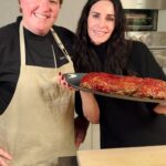 Courteney Cox Instagram - Better than your mom’s meatloaf Ingredients Caramelized Onions: 1 medium to large white or yellow onion (finely diced) 1 Tbsp Olive Oil or Avocado Oil 1 tsp kosher salt 1 Tbsp Worcestershire Panade Mixture: 5oz of Ritz Crackers or Golden Rounds Crackers (crushed in food processor) 5oz of Milk or Buttermilk Glaze: 3/4 cup Ketchup 3 Tbsp Brown Sugar 1 Tbsp Apple Cider Vinegar 1 tsp garlic powder 1 tsp onion powder Salt and Pepper to taste Meatloaf: 2 lbs of Grass fed Ground Chuck Beef (85% or 90% lean) 3 Tbsp Chopped Italian Parsley 2 Eggs (Beaten) 1 Tbsp Kosher Salt Instructions Pre-heat oven to 375 degrees F. Start by caramelizing the diced onions on medium high heat in a cast iron or heavy bottom pan. While the onions are cooking start by making the panade mixture. Add crackers to the food processor and pulse until completely ground and no large pieces remain. Measure out 5oz of cracker crumbs and add to a bowl. Measure out 5oz of Buttermilk or Milk and mix together with cracker crumbs. Once the onions have become caramelized, add the Worcestershire sauce and then add that to the panade mixture. In a separate bowl, make your glaze by adding all the ingredients, mix well and set aside. In the bowl with the panade mixture, add the ground beef, parsley, eggs and salt. Also add a few Tablespoons of glaze to the beef mixture. On a sheet pan lined with aluminum foil or parchment paper add meatloaf mixture into a log shape. Bake in oven for 40 minutes and remove meatloaf. Brush glaze on top and return meatloaf to oven. Continue cooking meatloaf an additional 15-20 minutes or until the internal temperature is 160 degrees F. Remove from oven and let rest 10 minutes before slicing.
