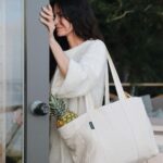 Courteney Cox Instagram - The @homecourt Tote is out! Originally designed as a cleaning caddy but is perfect for the beach, farmer’s market, traveling and so much more. And the best part is…it’s sustainably manufactured with @thenewdenimproject using upcycled materials!