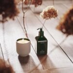 Courteney Cox Instagram - I’m so excited to finally have my candles and hand cream out in the world. I wanted the candle’s fragrance to be strong enough to fill a room and the vessel shape and color to go with any style. The prototype was actually hand thrown in my backyard. I wanted to make a hand cream that was super hydrating without being greasy and with a beautiful scent. We finally made it! I’m so happy with both…I hope you are too. Go pre-order now. 🧡 @homecourt
