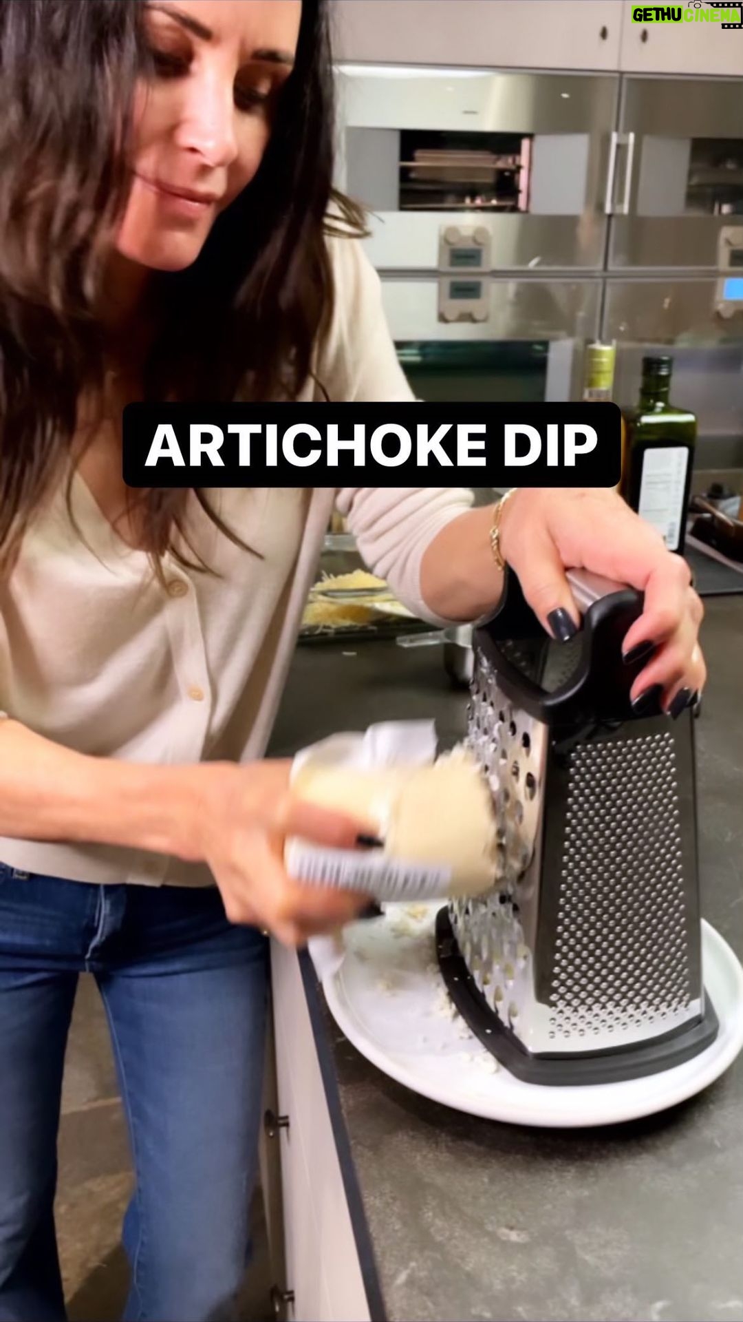 Courteney Cox Instagram - Healthy for the holidays? 🤷🏻♀️ Ingredients: 2 cans of artichoke hearts 1/2 cup of mayonnaise 2/3 cup of shredded parmesan 1 cup shredded mozzarella First, drain two cans of artichoke hearts, put them in a mixing bowl and cut into bite size chunks. Stir in a 1/2 cup of mayo. Add 2/3 cup of parmesan cheese, then add one cup shredded mozzarella cheese. After you've mixed everything together, put in a shallow baking dish. Bake at 375° for 40 to 45 minutes or until golden brown on top. #courteneycoox