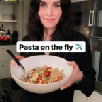 Courteney Cox Instagram – Happy #NationalPastaDay!
Here’s one of my favorites: Pasta Alla Checca

*Fresh garlic chopped (lots)
*Roma or cherry tomatoes 
*Buffalo mozzarella (in water)
*Basil (lots)
*Olive oil
*Penne pasta 
*Fresh grated parmigiana
*Salt and pepper 

1. Chop tomatoes (de-seed if you want), add basil + salt and pepper, place in bowl. Cover and let marinate.
2. Slice a ton of garlic and brown in olive oil. 
3. Boil water/cook pasta.
4. Drain water from mozzarella and cube.
5. When pasta is done, drain + add tomatoes/basil mixture with any juice made from the marinating tomatoes.
6. Add cut mozzarella.
7. Add warm garlic olive oil.
8. Add parmigiana + salt and pepper to taste.

Optional: add red pepper flakes if you want a little kick.

#courteneycoox