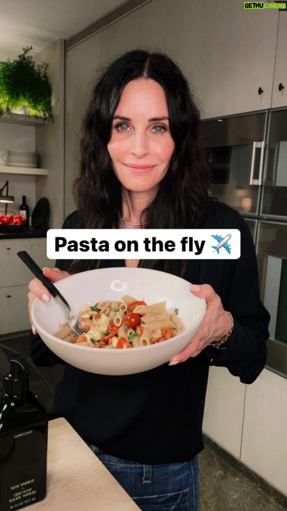 Courteney Cox Instagram - Happy #NationalPastaDay! Here’s one of my favorites: Pasta Alla Checca *Fresh garlic chopped (lots) *Roma or cherry tomatoes *Buffalo mozzarella (in water) *Basil (lots) *Olive oil *Penne pasta *Fresh grated parmigiana *Salt and pepper 1. Chop tomatoes (de-seed if you want), add basil + salt and pepper, place in bowl. Cover and let marinate. 2. Slice a ton of garlic and brown in olive oil. 3. Boil water/cook pasta. 4. Drain water from mozzarella and cube. 5. When pasta is done, drain + add tomatoes/basil mixture with any juice made from the marinating tomatoes. 6. Add cut mozzarella. 7. Add warm garlic olive oil. 8. Add parmigiana + salt and pepper to taste. Optional: add red pepper flakes if you want a little kick. #courteneycoox