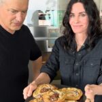 Courteney Cox Instagram – Seriously the best damn cookie I’ve ever had! 

CHOCOLATE CHUNK WITH MALDON SEA SALT
    
1 7/8 C CAKE FLOUR (8 1/2 oz)
1 2/3 C BREAD FLOUR
1 1/4 teaspoon BAKING SODA
1 1/2 teaspoons BAKING POWDER
1 1/2 teaspoons KOSHER SALT
1/8 teaspoon NUTMEG

1 1/4 C UNSALTED BUTTER (2 1/2 sticks)
1 1/4 C	LIGHT BROWN SUGAR (10oz)
1 1/8 C WHITE SUGAR (8oz)
2 LARGE EGGS
2 teaspoons NATURAL VANILLA EXTRACT 
2 C BITTERSWEET OR SEMI SWEET CHUNKS OR DISCS
3/4 C MILK CHOCOLATE CHUNKS

CHOCOLATE FEVES OR LARGER 1” CHUNKS FROM A BAR
MALDON SEA SALT

All ingredients room temperature.

Whisk the flours (or 4 C gluten-free flour if you wish) together with the baking soda, baking powder, kosher salt and nutmeg and set aside

In the bowl of a stand mixer, beat the butter and sugars at high speed for at least 4 minutes

Add the eggs and vanilla and beat for at least 2 more minutes

Add the flour mixture and mix on the slowest speed JUST until combined. (If you see a little bit of flour left, that’s ok, finish mixing it with a wooden spoon.

Mix the dark chocolate and the milk chocolate in a bowl 

Mix the chocolates into the dough with a wooden spoon or your hands

Put the finished dough in a container or wrap in plastic wrap and refrigerate for 36-48 hours.

Preheat oven 350 degrees.

Line a large sheet pan with parchment.

Take out dough, scoop into 4oz balls (about a 1/3 cup) 
Place the dough balls 2”-3” apart on the large parchment lined sheet pan.  Do not crowd the pan…a 1/2 sheet pan can take about 4 cookies this size.
Slightly press a larger chocolate chunk into the center of each dough ball.
Bake on the center rack of the oven for 19 minutes…(there should be a mixture of golden brown and slightly darker light brown on the top of each cookie.  
Let cool on the sheet pan for at least 15 minutes and then transfer to a cooling rack to cool completely. When the cookies are cool but the chocolate is still glossy, sprinkle sparingly a few flakes of the Maldon Sea Salt.