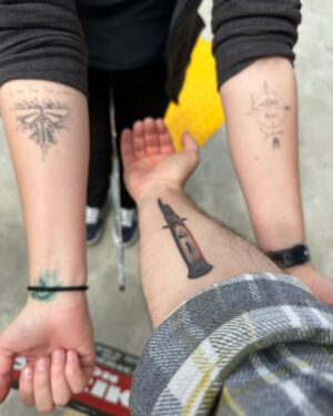 Craig Mazin Instagram - Enjoy this picture of TLOU tattoos meeting each other on the picket line. But mostly… follow me on Threads. Still @clmazin as always.