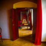 Crispin Glover Instagram - Looking back from the end bedroom, which is now being renovated, can be seen through the red salon, through the salon with the wallpaper from the 1700's, through the blue entry salon, and finally to the master bedroom. Zamek Konarovice Czech Republic