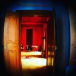 Crispin Glover Instagram - Looking in to the master bedroom from the doorway of the blue salon a similar view to the previous photo circa 1930 can be seen. The master bedroom was the first room painted when the chateau was acquired 13 years ago. There was no knowledge or evidence of frescos and the room was still painted beige from the Communist era. At some point the walls may be scraped to reveal the frescoes as seen in the previous photo. Or perhaps the evidence of an even older fresco may be revealed if the walls are newly scraped. Zamek Konarovice Czech Republic.