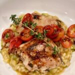 Cristina Ferrare Instagram - Tonight’s dinner inspired by Stanley Tucci: Searching For Italy! Risotto with pan seared chicken, baby heirloom tomatoes and fresh herbs! Last Sundays episode was from the northern region of Italy where my family is from! I’m obsessed with this show and the wonderful journey @stanleytucci takes us on! #italy #italia #italiangirl #italia🇮🇹 #italianfood #italiancuisine #laspezia #liguria #portofino #searchingforitaly #cnn #food