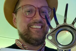 Dan Deacon Instagram - I’m so happy and totally blown away to have won my first Cinema Eye Honors award last night for Outstanding Achievement in Original Music Score for my score for Ascension!!!!!

Thanks so much to Jessica @jk_or_am_i , Nate @nathantruesdell and Kira @skkira for bringing me on the team to score your beautiful film. Jessica thanks so much for the amazingly collaborative and adventurous process you fostered! And congrats on all your wins last night too!!!

Thank you to Ledah @ledahfinck and Owen @owww.en.gardner for being such incredible musicians and improvisers. Working with those sessions we did brought me such joy and I cannot thank you enough. Thank you to Craig @craigwbowen at Tempo House @tempo_house_recording  to engineering the sessions masterfully and making the most insane espresso. 

Thank you to all of you who have been supporting my weird music for the last 20+ years. Thank you so very much from the entirety of my heart. 

Thank you @cinema.eye.honors for recognizing all the aspects of documentary filmmaking! 

You can stream @ascensiondocumentary on Paramount+ and you can stream my score on all streaming platforms. Links in bioooooooooooo