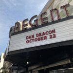 Dan Deacon Instagram - Hi! Tour starts tonight in LA. The last time I was here was March 13th 2020, we drove the bus to an RV park by the airport and basically waited for the world to end and shutdown to being. The last few photos are from that weird night back in 2020. Feels surreal to be back, picking up where I left off. So much is different now. Feels like a parallel universe. I’m glad to be doing these few shows now and for anyone in a city that couldn’t happen on this run, please know it wasn’t an easy choice to make. I am doing the best I can to transition back into touring after such a long and insane break from it. Stay safe, get /axxed, mask up, sassy as fuck at all times The Regent