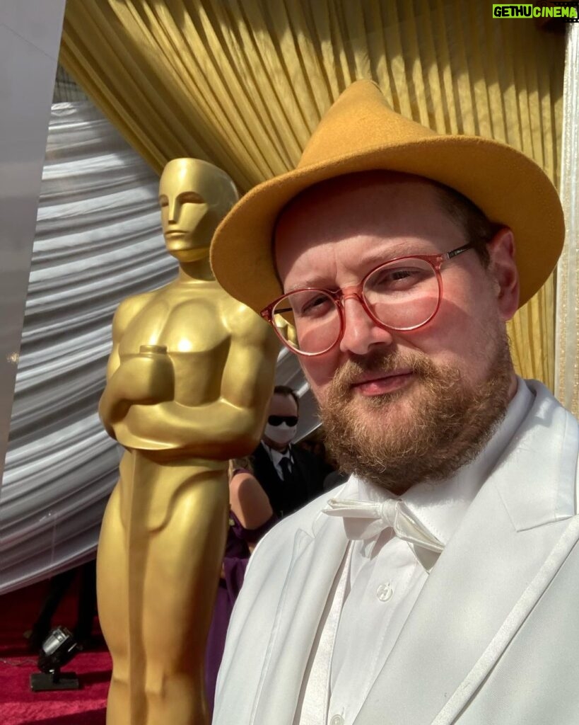 Dan Deacon Instagram - Went to the Oscars and walked the red carpet with the @ascensiondocumentary team! Brief and incomplete summary of highlights: It was bonkers. -Anthony Hopkins told me he liked my hat. -Met Bill Murray and I could hardly speak. -The chocolate Oscar’s at the Afterparty are coated in a gold glitter that gets on everything you touch. -They do not want you to take table cloths home and ask you to put it back if you try to wrap up a chocolate Oscar in it so you stop getting gold powder on everything. Thanks to event who sent me pictures when they spotted my hat on TV. THANK YOU so much to @jk_or_am_i for including me on the team for Ascension and having such a brilliant and unique vision!!!! I love this film. I love working with you and I am so beyond excited to see what you create next!!! Congrats to the whole team! It was amazing to celebrate how far this super weird movie has made it. Congrats to @questlove and the whole Summer Of Soul team for your well deserved win! Ok flying to join back up with the @futureislands tour. See you soon Dublin! Thank you so much to all of you for your support in my weird life ❤️ The Oscars Red Carpet