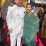 Dan Deacon Instagram - Went to the Oscars and walked the red carpet with the @ascensiondocumentary team! Brief and incomplete summary of highlights: It was bonkers. -Anthony Hopkins told me he liked my hat. -Met Bill Murray and I could hardly speak. -The chocolate Oscar’s at the Afterparty are coated in a gold glitter that gets on everything you touch. -They do not want you to take table cloths home and ask you to put it back if you try to wrap up a chocolate Oscar in it so you stop getting gold powder on everything. Thanks to event who sent me pictures when they spotted my hat on TV. THANK YOU so much to @jk_or_am_i for including me on the team for Ascension and having such a brilliant and unique vision!!!! I love this film. I love working with you and I am so beyond excited to see what you create next!!! Congrats to the whole team! It was amazing to celebrate how far this super weird movie has made it. Congrats to @questlove and the whole Summer Of Soul team for your well deserved win! Ok flying to join back up with the @futureislands tour. See you soon Dublin! Thank you so much to all of you for your support in my weird life ❤️ The Oscars Red Carpet