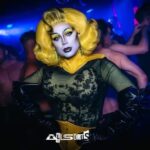 Daniel Wallace Instagram – Had a lovely time revisiting my old haunts on Saturday!Theres been a few changes but it was nice to go back…where it all began!*Cue Sunset boulevard/glenn close music*
Here i am wearing a gorgeous new @florencias_wigs and collar and waspie belt by @misty_couture 💛🖤
Decided to pay homage to my original Aftershock lewk (club is now @Allsorts)And go with the same yellow/black hazard tape colour combo!
times were simpler then….all i had was hazard tape a face full of Snazaroo an old Tina Turner wig and a dream!And look at me now!It gets better kids!😂 Cruz 101 Manchester