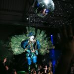 Daniel Wallace Instagram - Had a #lovelytime performing for @thefirehousemcr on Thursday!If you haven't been you really should!The space is so fabulous...The show is amazing....a runway...a catwalk...drag....i hear the food is delicious and i can highly recommend the spicey margarita's!(might have indulged) Here i am living my #peacock fantasy and being a big old attention seeking show off all in the name of the platty joobs!Wearing @lizziebiscuits and hair by @wigsbydaviddarby And i got to meet the lovely @dakota.schiffer 💙 Photo's by the uber talented @squxsh__ #Drag #Manchesterqueen #Jubilee #royalty The Firehouse