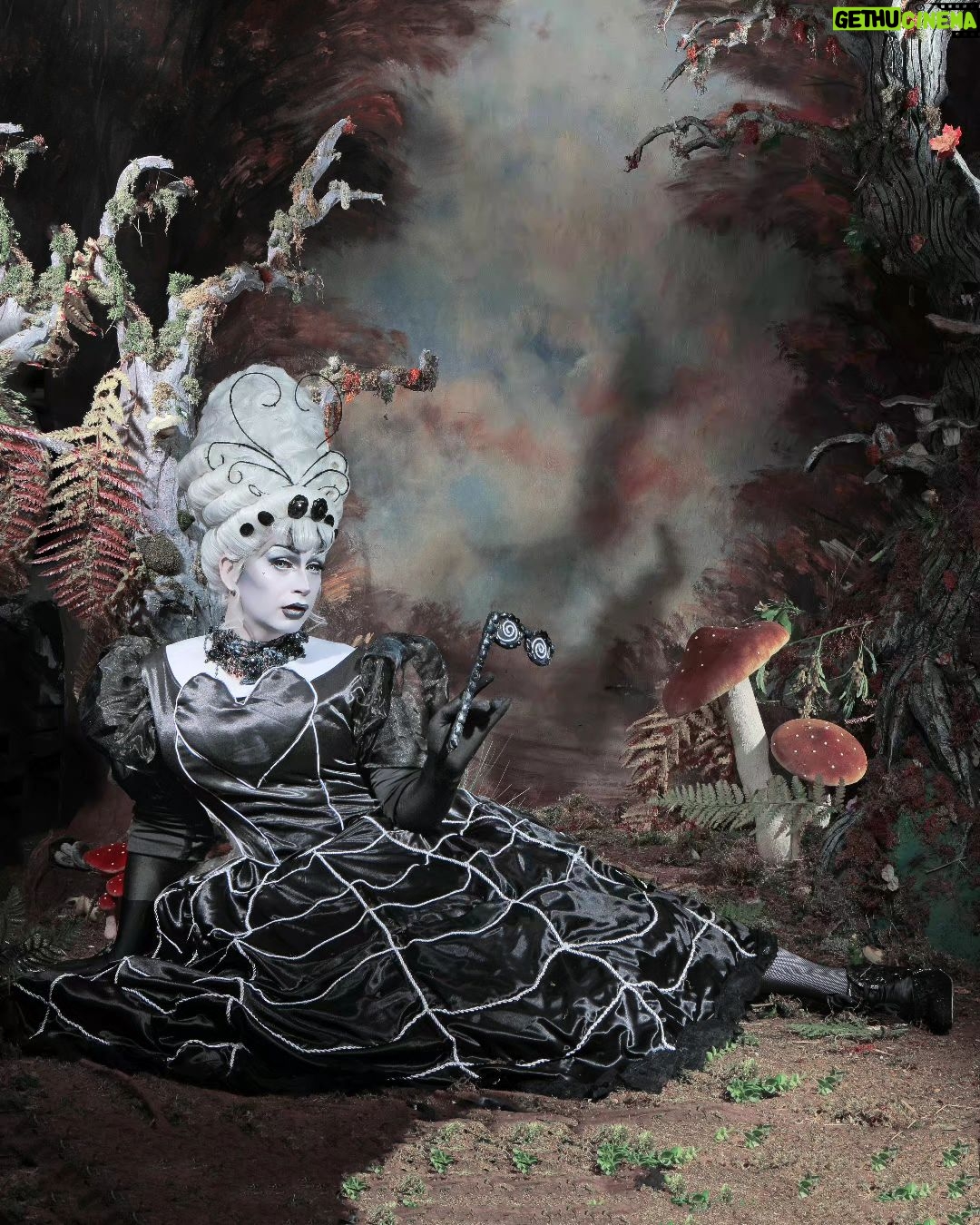 Daniel Wallace Instagram - Little miss muffet sat on a tuffet eating her curds and whey, along came a spider and sat down beside her and frightened miss muffet away.... Just look at this gorgeous image of me Snapped by @neilnezkendall in a spooky ooky gothic wood! Wearing @lizziebiscuits and @florencias_wigs ๐ท๐ธ #spider #blackwidow #hypnotized #operaglasses #littlemissmuffet #Drag #dragqueen #manchesterqueens #spiderweb Chester, Cheshire