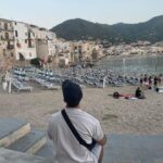 Daniele Rizzo Instagram - If you can do - go to #Cefalú! And of course visit other places in beautiful #Sicily ♥️ Swipe to see me looking like an American Tourist. Had a lot of Granita con Brioche from @ritrovo_orchidea 🤌🏽 @visit__sicily @cefalu.sicily #tindari #veryitalianperson #italianactor #germanactor Cefalù Sicily