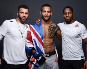 Danny Roberts Instagram - The events in the spotlight have been devastating - even more when you reach the harrowing realisation that this is cyclical (think Mark Duggan, Stephen Lawrence, Sandra Bland, Breonna Taylor and, of course, George Floyd, RIP). However, there’s a narrative that portrays racism as direct and violent but racism is more complex than that. It’s covert. It’s pervasive. It’s systematic. If you realise it or not, it’s expressed across social, political and economic spheres and effects us in many different ways.

Black Lives Matter and it should not take the loss of one for people to want to make a change. @chakabars posted something that said when stars are out protesting and blacking out their pages, ask them how many of their managers, publicists, staff and agents are black. 
Through my own research, one of the ways I believe we can make a change is by including black people in our business endeavours and positively impacting the lives of those who are still with us.

Above is my corner at UFC Russia. #TeamChocolate is multicultural (S/O white chocolate @henrihooft) but I was proud to stand next to these black men of merit after that win. To the left is my coach, @coachgjones - 1 of the most successful collegiate wrestlers of all-time and 1 of only 39 people to have achieved 3 NCAA wrestling titles. To the right is my agent @yurijavier - a Solicitor who graduated with a 1st Class Law Degree before becoming a part of my team. 
I don’t have all the answers but I hope that I and those around me will inspire the next generation to be great and not only aim high but achieve high. I hope that people fight for change when it’s no longer a trend. We must look inwards to our own actions. We can’t do it alone. We need unity. We need equality. We need justice. We need change #BlackLivesMatter.

PS we know ALM but all lives aren’t under threat. I came across an analogy to sum it up: “saying All Lives Matter in response to #BlackLivesMatter is like your house being on fire and when the fire service come to spray your house down your neighbour says that all houses in the neighbourhood should be sprayed because all houses matter” if you can’t comprehend that that, go figure ✊🏽🖤