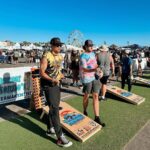 David Lim Instagram – Summer vibes with my bro @tony.smith0, the @americancornholeleague MVP and #1 ranked player in the world. 😎🎡🌴🕳️

Huge thanks to @thethrowdowncornholefestival for letting us come crash the party. 

#airmailcity
#thethrowdown Ventura, California
