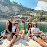 David Lim Instagram - Italy is amazing. It’s even better with great friends. 😎🌊⚓️🇮🇹 #sicilysquad #taormina #isolabella #boatday Isola Bella, Taormina, Sicily