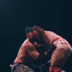 David Michael Harwood Instagram - One year ago, today, we the had the greatest match of our career. To me, it encapsulates everything FTR has represented; emotion. We couldn’t have achieved that without having our equals there to bring that emotion out of us. The story going into this match proves that, whatever you believe, there HAS to be something bigger than us out there. This night, we all 4 sat in the locker room, no one around, bloody from head to toe, each with a tequila in our hand, talking about the end of this rivalry. How we’ll never experience anything like this again. How all four of us, from now until forever, would be connected; and we were ok with that. How years from now, decades from now, we’d be traveling to conventions and meet & greets just to talk about this rivalry and THIS ONE MATCH in particular. Then it all changed. The picture of Jay, the intensity on his face, a chain wrapped around my mouth, the emotion in Paul, Cash desperately doing everything in his power, even if it means losing, to save his best friend from death while Mark is using every last ounce of energy in his body to block him, is the greatest snapshot of my career. Everyone that had a hand in this match & this moment, from Tony, The Briscoes, Cash, Paul, Posey, the camera men, the producers, I can’t thank you enough for what you’ve given me, my career, and my life.