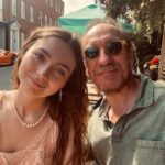 David Thewlis Instagram - Gracie with one of her gifts (that tiny G around her neck, not the orange car behind us)