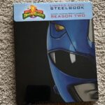 David Yost Instagram - FOR CHARITY - POWER RANGER POWER PACK to support the Arts in school. Click on the link in my bio to Bid All items will be signed by me • Original Script from “The Green Candle” Saga (Episode 34, Part 1) includes Original Call Sheets • Limited Edition Steel book DVD set of Season 2 of Mighty Morphin Power Rangers • Bioworld Mighty Morphin Power Ranger Baseball Cap • 1994 TV Guide Featuring Power Rangers • Original Mighty Morphin Power Rangers Cast Photo • Super 7 MMPR Megazord Action Figure • Boom Studios Exclusive Variant Issue 5 Mighty Morphin Power Rangers & Teenage Mutant Ninja Turtles crossover Comicbook • Boom Studios Exclusive Blue Ranger Variant Issue 6 Mighty Morphin Comicbook #powerrangers #blueranger #affirmative #affirmyourself #charity #