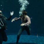 Dempsey Bryk Instagram - got to combine my passions of scuba diving, acting, and looking at James Bond on a Zodiac boat Pinewood Studios