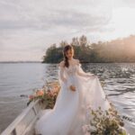 Denise Soong Ee Lyn Instagram - this is a Disney dream come true ✨ I am so happy we did this with the talented team (left their handles below) We wanted to have a shoot in Bali, because Nigel & I love to travel, and enjoy being by the water. When the team heard about this, they decided to bring a slice of Bali to us, since we couldn’t fly. I mean, how crazy is this. They got a boat and paddles and all?! I’ll never forget this day and I am so thankful to the team for their vision and talent 💕 Photographer: @heystranger.photography @sam.heystranger @michael.heystranger Gown & Suit: @bridefullyyours Makeup: @dearmuse.makeup @coco_dearmuse @annie_dearmuse Florals: @5amflowers
