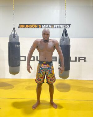 Derek Brunson Instagram - 2021 Blonde Brunson kicked the door 🚪 in , 2022 it’s Blonde Brunson 👱🏾‍♂️season 🏆. Setting it off Feb 12 in Houston #BuiltDifferent #BlondeBrunson.  HAPPY NEW YEARS ALL 🥳 🎊🎈🎆 @brunsonsmmaandfitness Merch available @ https://derekbrunson.com/ . Link in the bio