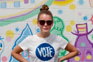 Devon Hales Instagram - Voter Registration at the link in my bio. Whatever your reason, let’s get out and do it. Your glorious, singular voice DOES make a difference. Always. 💙 Thank you @asherbrand for the shirt. Thank you @charityfaith for the pic.