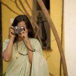 Dhanya Ananya Instagram - A 90s enchantment as she steps out, embracing the world with a timeless smile. Ft: @kanmaniii3 Captured by: @ladyc.am Mua: @_the_glam_factor___ Saree: @jaanki_sarees_ Location: @design.ashram