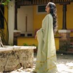 Dhanya Ananya Instagram - A 90s enchantment as she steps out, embracing the world with a timeless smile. Ft: @kanmaniii3 Captured by: @ladyc.am Mua: @_the_glam_factor___ Saree: @jaanki_sarees_ Location: @design.ashram