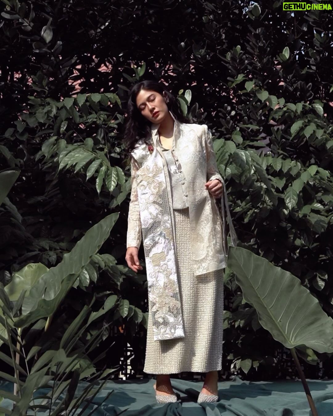 Dian Sastrowardoyo Instagram - In this latest #SAPTOJOEditorial styled by Hagai Pakan, the focus is not just on showcasing the traditional garment but infusing it with a modern twist. The ultimate aim is to spark inspiration among enthusiasts, encouraging them to explore innovative and modern pairings that transcend the conventional boundaries of this cultural attire. Visit the link in bio for the complete article. Dian Sastrowardoyo wears a custom oyster-colored Yayi Darpana Kebaya Janggan, Yayi vest (worn underneath), Rimpang selendang, and hand-embellished Sangkar midi skirt. Photographer: @bramsky.bramsky Fashion Stylist: @hagaipakan Makeup Artist: @ryanogilvy Hair Stylist: @iwanetaufik_hair Location: @thedharmawangsa #SAPTOJOHeritage #SAPTOJOBerkain #SAPTOJOEditorial