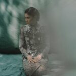 Dian Sastrowardoyo Instagram - The distinctive Kebaya Janggan from Yogyakarta derives its name from the Javanese term “Janggan,” eloquently signifying an ensemble that gracefully covers the neck. By bringing Kebaya Janggan into the spotlight, @hagaipakan initially sought to elevate the fashion allure of the costume showcased in Gadis Kretek. View the article via the link in bio. @therealdisastr wears a custom-made organza Kebaya Janggan with #SAPTOJOPattern Kadazan leitmotifs and Sitta Heels, both in Nero palette. Photographer: @bramsky.bramsky Fashion Stylist: @hagaipakan Makeup Artist: @ryanogilvy Hair Stylist: @iwanetaufik_hair Location: @thedharmawangsa #SAPTOJOHeritage #SAPTOJOBerkain #SAPTOJOEditorial